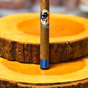 Harlem Renaissance African Cameroon Toro Spring Limited Edition cigar displayed on wooden ashtray with blue band detail.