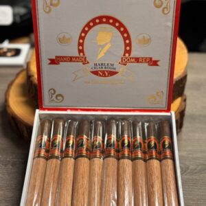 Open box of Harlem the Brother Churchill Habano cigars with red and gold branding and individually wrapped premium cigars displayed in rows.