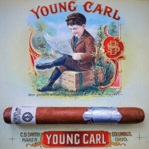Vintage Young Carl cigar label featuring a young boy reading a newspaper while sitting on cigar boxes, Columbus, Ohio.