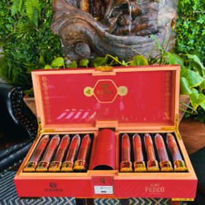 Plasencia Alma del Fuego red cigar box open displaying premium cigars with gold bands and red leather humidor in center.
