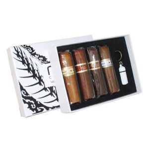 Nub Variety 4-Cigar Sampler gift box with four premium cigars, gold bands, and white punch cutter tool on black display insert.