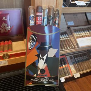 Handmade Dominican Republic cigars display with colorful art deco packaging featuring a stylized man in a fedora and bow tie, showcasing five premium cigars.