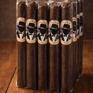 Bundle of Harlem Renaissance Caffe cigars with vintage-style labels featuring a man in a fedora hat, displayed on a wooden surface.